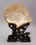 A GOOD 19TH CENTURY CHINESE CARVED MOTHER OF PEARL SHELL ON STAND, the shell carved in canton