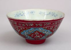 A GOOD 19TH CENTURY QAJAR FAMILLE ROSE PORCELAIN BOWL, with a pink ground and turquoise border