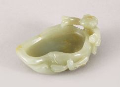 A GOOD 19TH / 20TH CENTURY CHINESE CARVED CELADON JADE BRUSH WASHER - LOTUS AND BOY, the brush