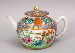 A 19TH CENTURY CHINESE FAMILLE ROSE PORCELAIN TEA POT, with panel decoration of native floral