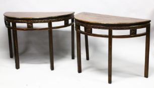 A FINE PAIR OF 18TH / 19TH CENTURY CHINESE CARVED HARDWOOD DEMI LUNE TABLES, the tops with a