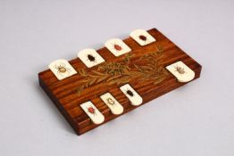 A JAPANESE MEIJI PERIOD SHIBAYAMA BEZIQUE GAMES MARKER, with inlaid decoration on ivory insects,