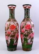 A GOOD PAIR OF 20TH CENTURY CHINESE PEKING GLASS VASES, the vases overlaid with decoration of