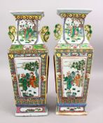 A PAIR OF 19TH CENTURY CHINESE CANTON FAMILLE ROSE PORCELAIN VASES, the body of the vases with