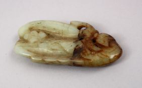 A CHINESE CARVED JADE PENDANT OF A CHILONG AND FRUIT, 8cm.