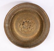 A 19TH CENTURY INDAIN BRASS CHARGER / DISH, with embossed decoration, 25cm