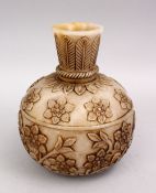 A HEAVY INDIAN MUGHAL CARVED JADE FLORAL VASE, the body of the vase with floral carved decoration,