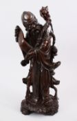 A LARGE 19TH / 20TH CENTURY HARDWOOD FIGURE OF SHOU LAO, with bone inlaid eyes holding his staff,