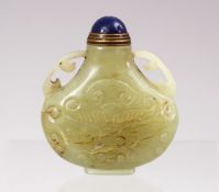 A GOOD CHINESE CARVED JADE SNUFF BOTTLE, carved with lotus decoration and twin handles, with lapiz