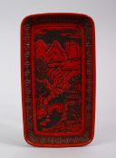 A 20TH CENTURY CHINESE CINNABAR LACQUER TRAY, with landscape views, 22cm x 12cm.