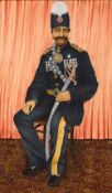 A GOOD PAINTING OF NASIR SHAH, in official uniform and seated, framed, painting itself measuring