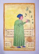 A INDIAN MUGHAL SCHOOL PAINTING MINIATURE OF NOBLEMAN, wearing a green full length gown with a cup