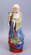 A GOOD 19TH / 20TH CENTURY CHINESE FAMILLE ROSE PORCELAIN FIGURE OF SHOU LAO, stood holding his