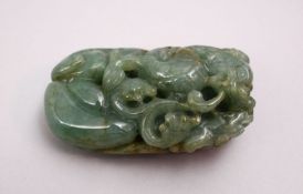 A CHINESE CARVED JADE PEBBLE OF A DRAGON, 8CM.