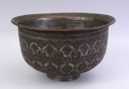 A GOOD SAFAVID BRONZE BOWL, carved with floral motif decoration, 26cm high.