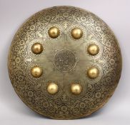 A 20TH CENTURY INDIAN CARVED BRASS CALLIGRAPHIC SHIELD, 40CM.