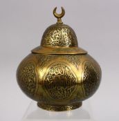A 19TH CENTURY DAMASCUS CAIROWARE BRASS CALLIGRAPHIC MOSQUE SHAPED CONTAINER, inlaid with black