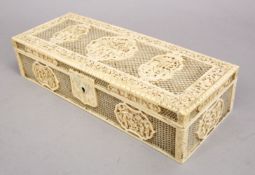A FINE QUALITY 19TH CENTURY CHINESE CANTON CARVED IVORY OPENWORK LIDDED BOX, the box with openwork