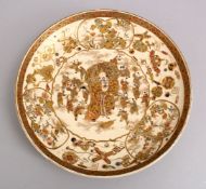 A JAPANESE MEIJI PERIOD SATSUMA CERAMIC DISH, the dish decorated with a central view of hotei and