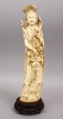 A 19TH CENTURY CHINESE CARVED IVORY FIGURE OF GUANYIN, 32cm.