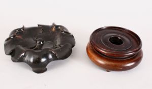 TWO GOOD CHINESE 19TH CENTURY HARDWOOD STANDS, one in the form of a lotus, 15.5cm, the other