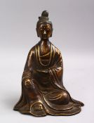 A CHINESE BRONZE FIGURE OF GUANYIN, in a seated position, 23cm high.