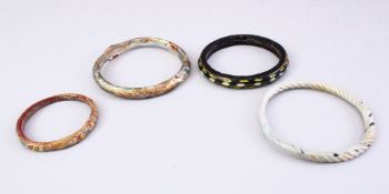 FOUR GOOD MAMLUK CARVED STONE / GLASS BRACELETS. largest 9cm.