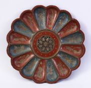 A 19TH CENTURY INDIAN ENAMELLED BRASS DISH, of lobed design, with pierced and engraved centre,