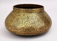 A GOOD 19TH CENTURY DAMASCUS BRASS CARVED BOWL, the bowl carved with formal floral motif, 25cm.