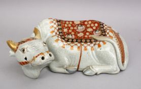 A GOOD JAPANESE MEIJI PERIOD KUTANI PORCELAIN MODEL OF A RECUMBENT OXEN / WATER BUFFALO, the buffalo