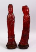 TWO CHINESE CARVED CHERRY AMBER FIGURES OF GUANYIN, both figures stood holding objects, with