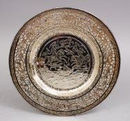 A PERSIAN ENGRAVED WHITE METAL OPENWORK DISH, 19CM.