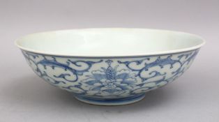 A GOOD 19TH CENTURY CHINESE BLUE & WHITE PORCELAIN BOWL, decorated with formal scrolling lotus