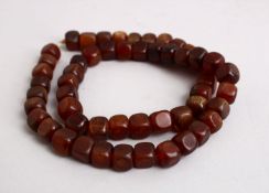 A SET OF 19TH CENTURY CHINESE SQUARE FORM RHINO HORN BEAD NECKLACE, Comprising 54 square beads,