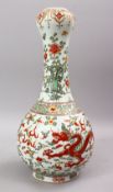 A CHINESE WUCAI DECORATED PORCELAIN VASE, the body decorated with scenes of dragons amongst stylized