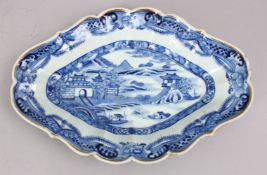 A GOOD 18TH CENTURY CHINESE QIANLONG BLUE & WHITE PORCELAIN MOULDED DISH, decorated with typical