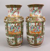 A PAIR OF 19TH CENTURY CHINESE CANTON FAMILLE ROSE PORCELAIN VASES, with panel decoration