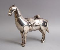 A FINE 19TH CENTURY COLONIAL OR SOUTH AMERICAN SOLID SILVER MODEL OF A HORSE, 26CM WIDE X 22 HIGH