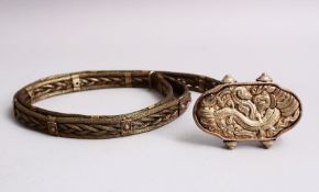 AN ORIENTAL WHITE METAL / SILVER BELT, with embossed decoration of mythical animals, 110cm open,