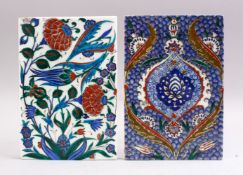 TWO IZNIK POTTERY TILE FRAGMENTS, each with floral decoration, 24cm x 16cm.
