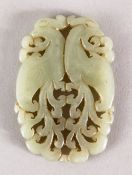 A GOOD 19TH / 20TH CENTURY CHINESE CARVED CELADON JADE PENDANT OF TWO PEACOCKS, two opposing