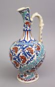 A GOOD POTTERY FLORAL DECORATED EWER FOR THE ISLAMIC MARkET, 35cm