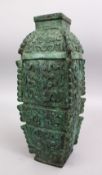 A CHINESE BRONZE ARCHAIC STYLE VASE, carved with archaic design, 37cm high.