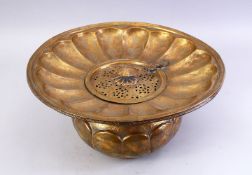 A GOOD LARGE 18TH/19TH CENTURY PERSIAN ENGRAVED BRASS BASIN, the centre with a hinged pierced cover,