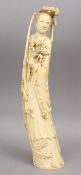 A 19TH CENTURY CHINESE CARVED IVORY FIGURE OF A FEMALE, 38cm high