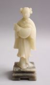 A GOOD CHINESE CARVED WHITE JADE FIGURE OF A GODDESS HOLDING A FISH, on a carved hardstone base,