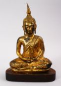 A GOOD QUALITY 19TH CENTUURY OR EARLIER THAI GILT BRONZE FIGURE OF BUDDHA, in a seated position upon