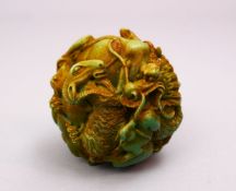 A CHINESE CARVED RESIN ZOOMORPHIC / ZODIAC BALL, 7CM.