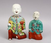 A LOT OF TWO CHINESE FAMILLE ROSE PORCELAIN FIGURES, one with a articulated tongue, 19cm & 15cm.