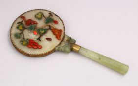 A 19TH / 20TH CENTURY CHINESE CARVED JADE / HARDSTONE MIRROR, the handle cylindrially formed, the